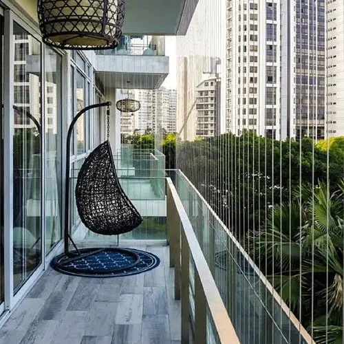 Invisible grill installed on a balcony railing