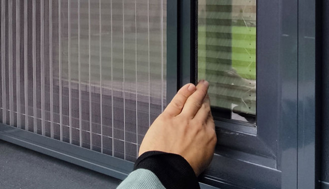 Pleated mosquito net fitted to a window
